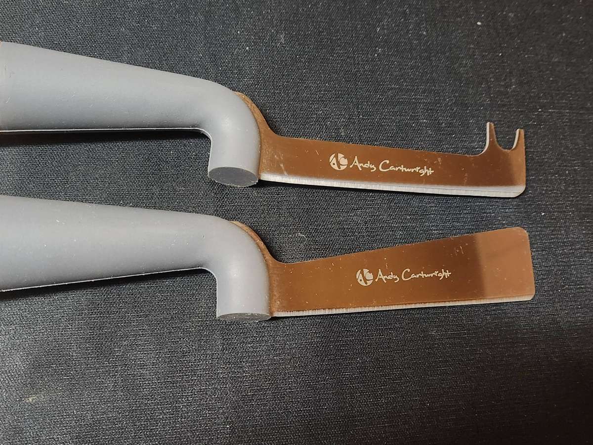 ANDY CARTWRIGHT CHEESE KNIFE SET ON A WOODEN BOARD