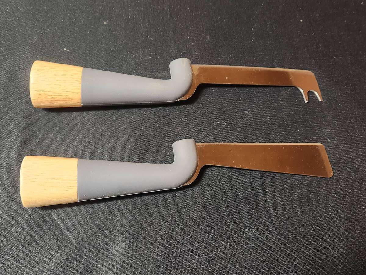 ANDY CARTWRIGHT CHEESE KNIFE SET ON A WOODEN BOARD