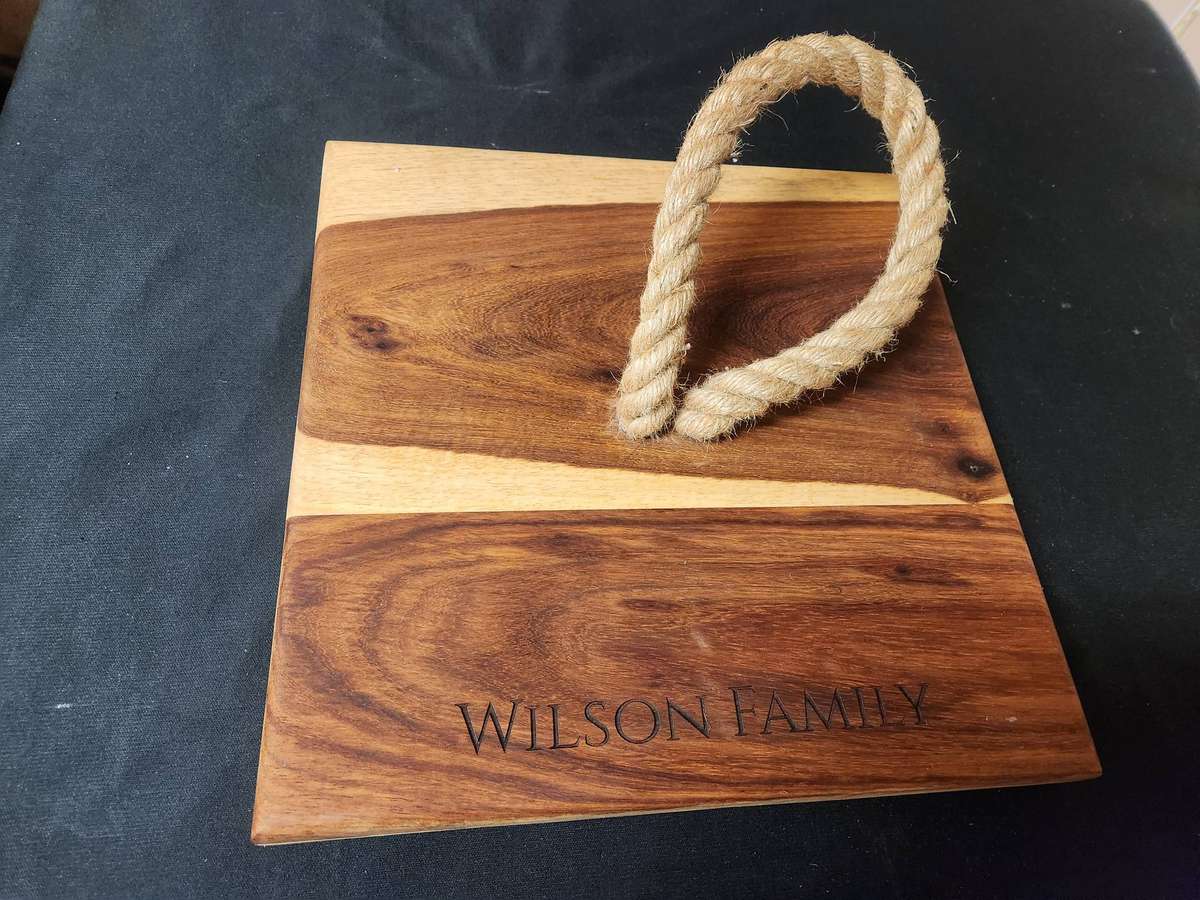 ANDY CARTWRIGHT CHEESE KNIFE SET ON A WOODEN BOARD