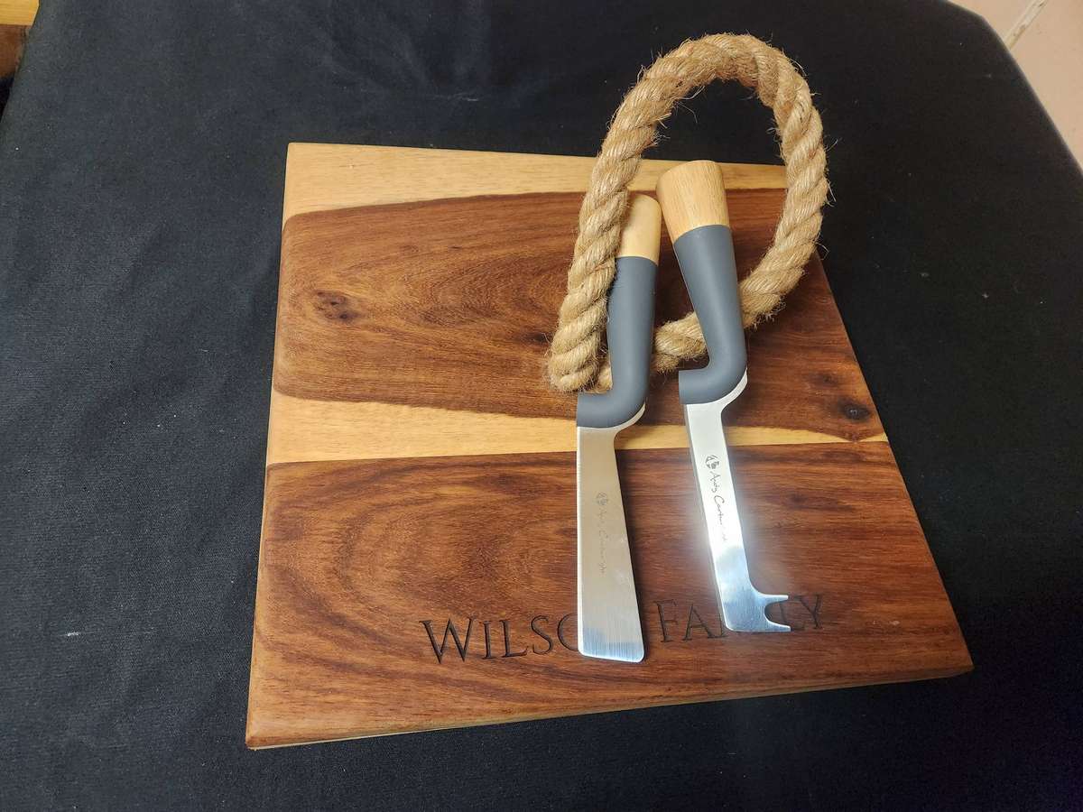 ANDY CARTWRIGHT CHEESE KNIFE SET ON A WOODEN BOARD