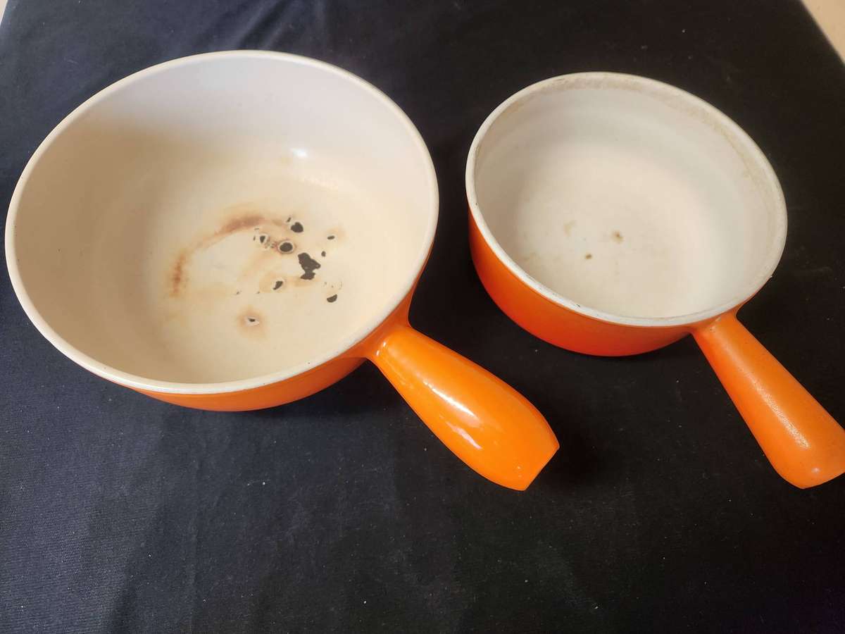 TWO VINTAGE LE CREUSET PAN-HANDLED POTS, NOS 18 AND 22