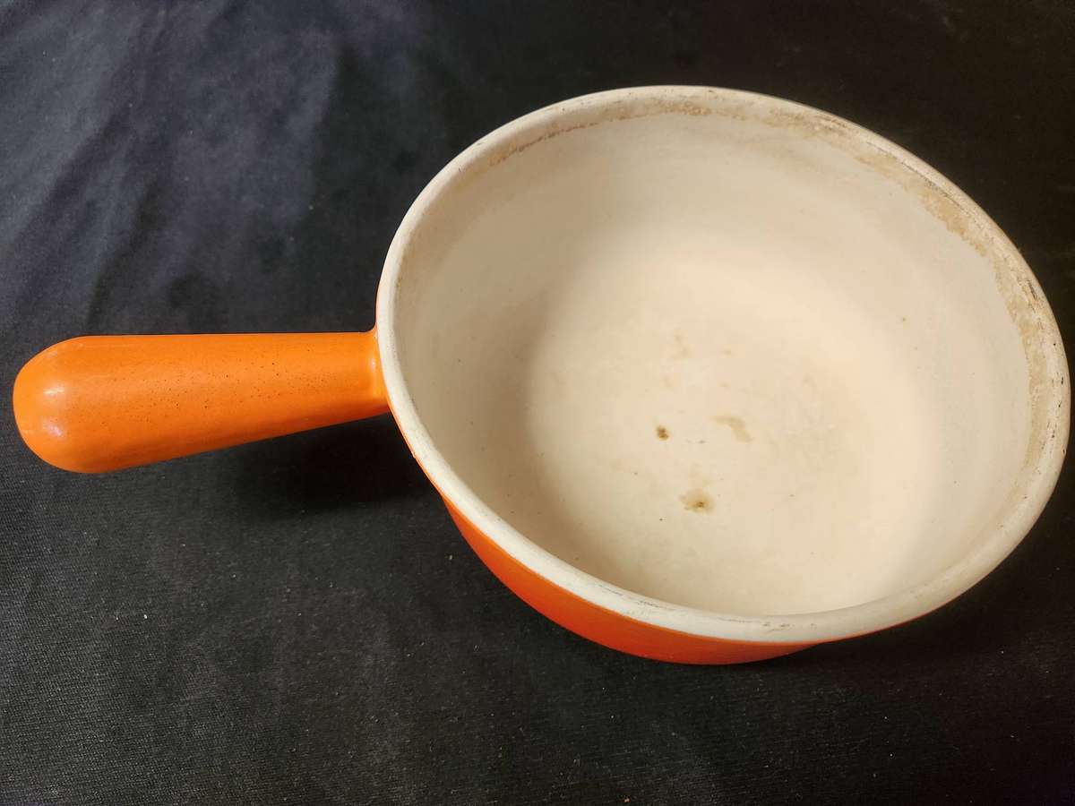 TWO VINTAGE LE CREUSET PAN-HANDLED POTS, NOS 18 AND 22