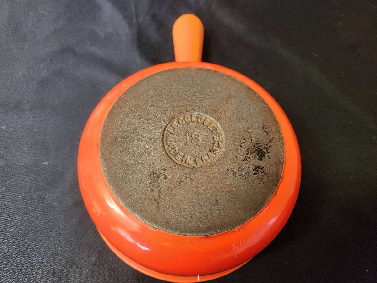 TWO VINTAGE LE CREUSET PAN-HANDLED POTS, NOS 18 AND 22