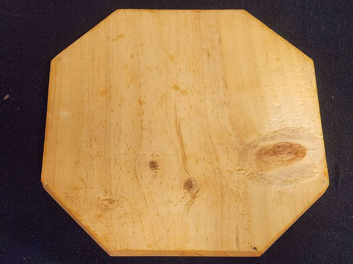 MARBLE SOLITAIRE GAME ON A WOODEN BOARD