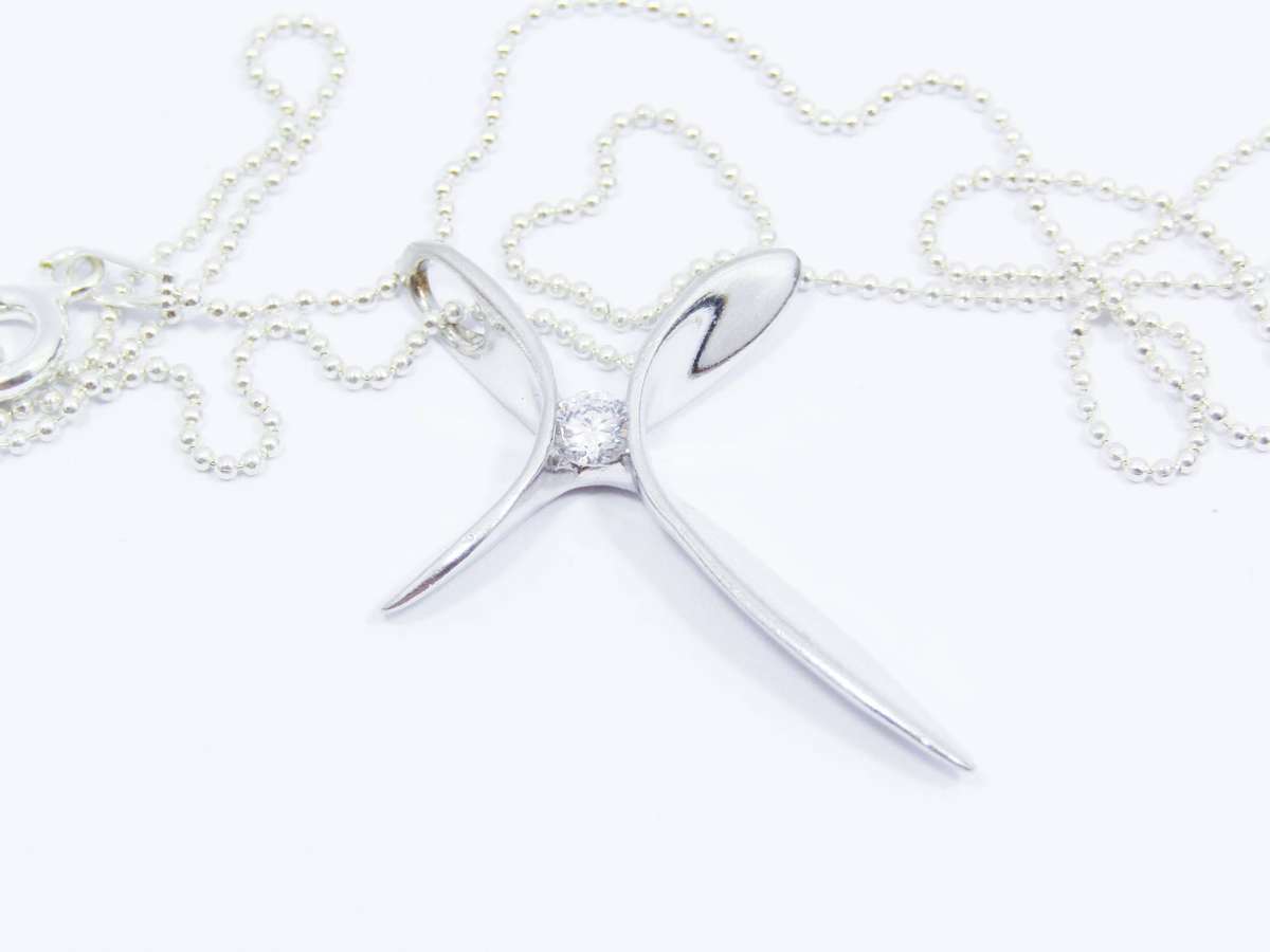 A Beautiful Abstract Design Cross with  a Tiny Zirconia on Chain in Sterling Silver