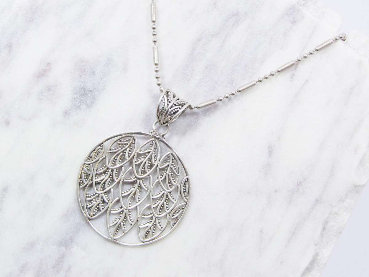 A Beautiful Large Round Leaf Design Pendant on Chain in Sterling Silver.