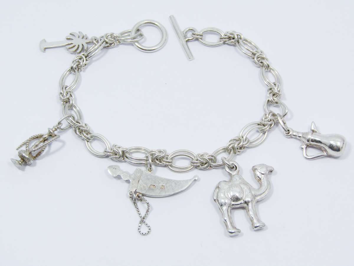 A Lovely Weighty Bracelet With Charms in Sterling Silver.