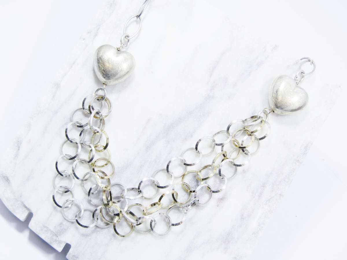 A Beautiful Puffy Heart Necklace Made up in Circles in Sterling Silver.