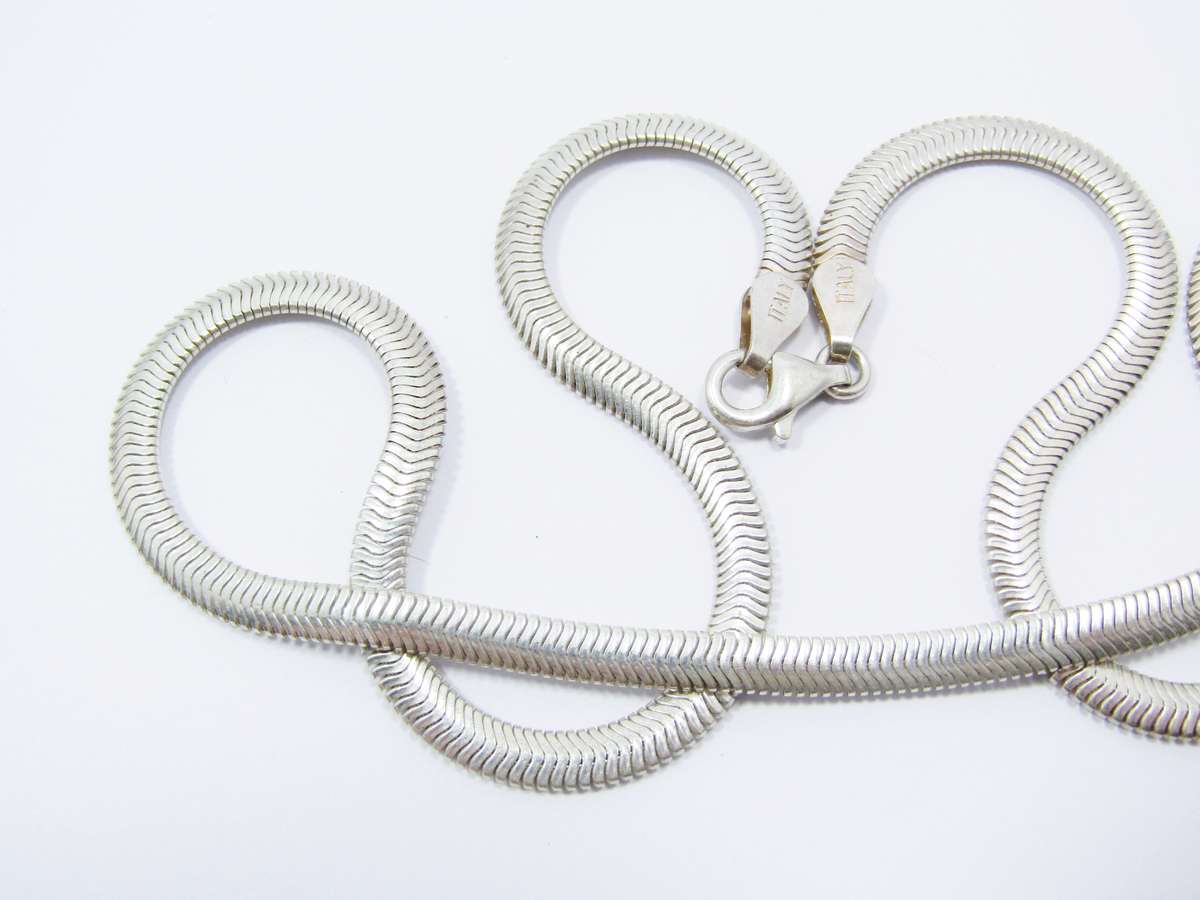 A Lovely Broad Flat Snake Chain in Sterling  Silver.
