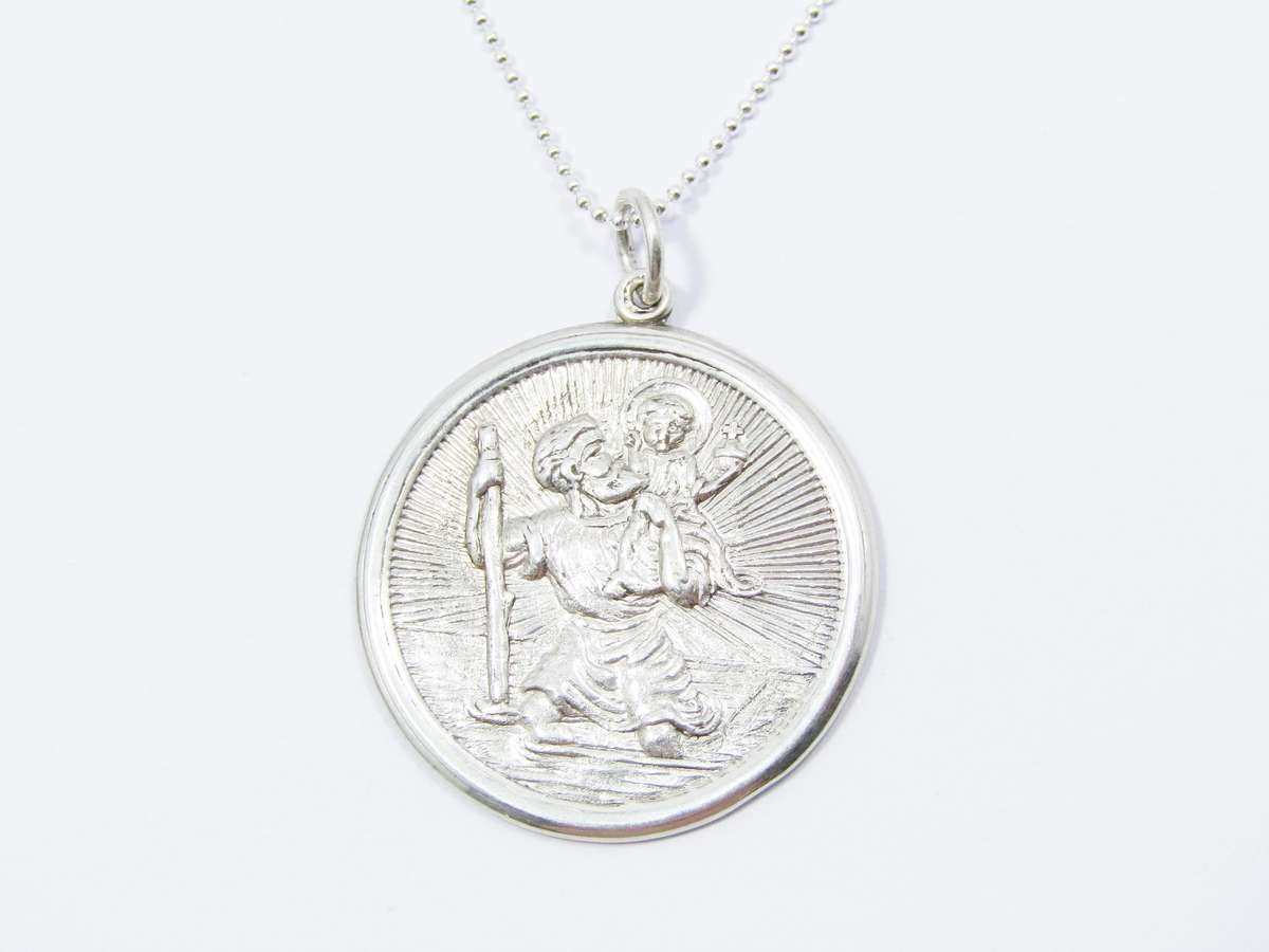 A Beautiful Detailed Round St Christopher Pendant on Chain in Sterling Silver.