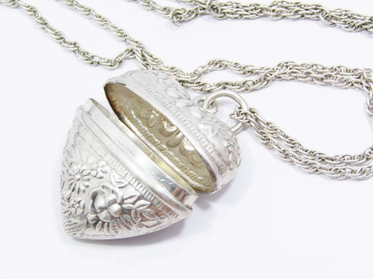 A Gorgeous Repoussé Large Keepsake Locket on Chain in Sterling Silver.