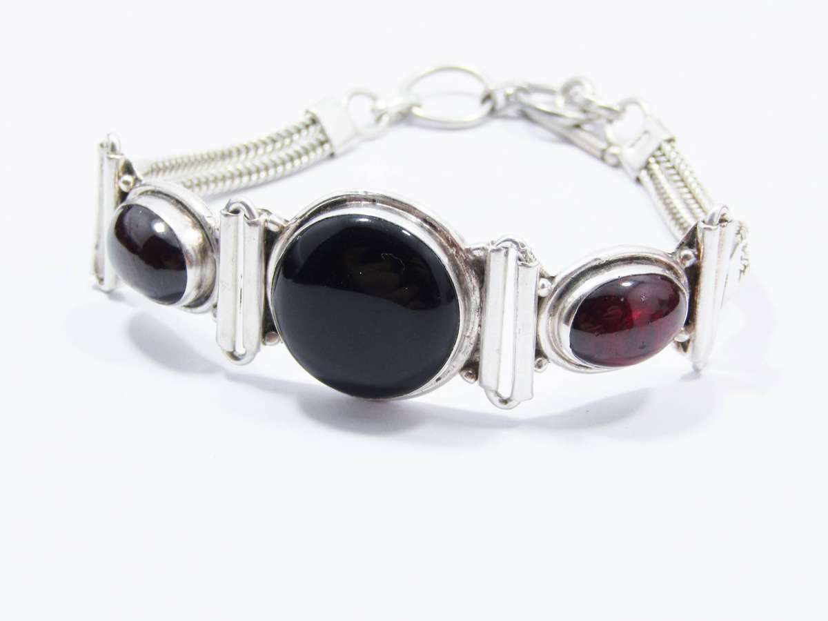 A Gorgeous Weighty Cabochon Garnet and Onyx Gemstone Bracelet in Sterling Silver.