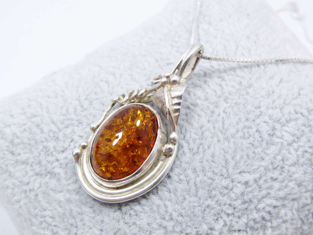 A Beautiful Detailed Amber Pendant on Chain in Sterling Silver