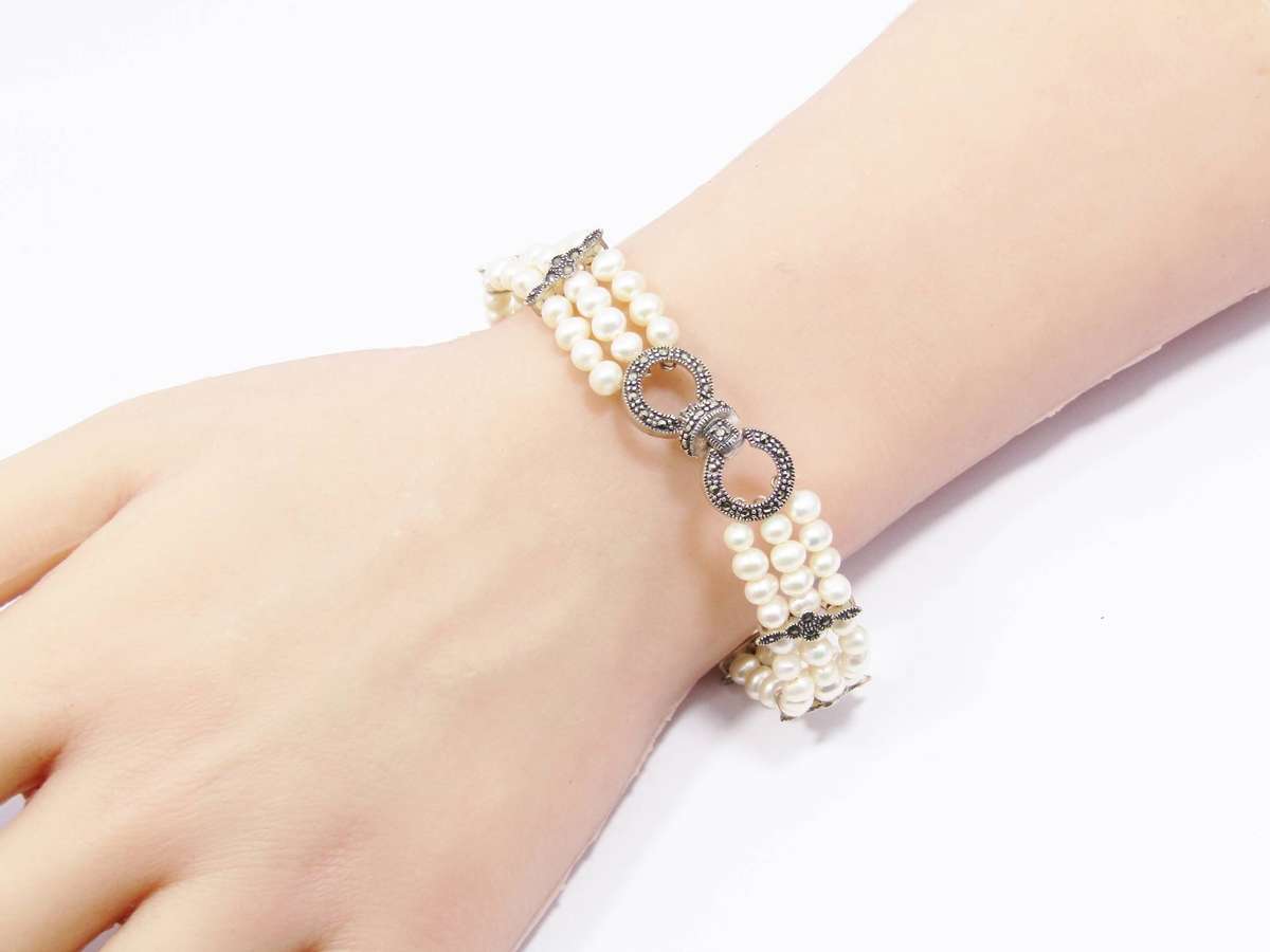 A Beautiful Multi Strand Fresh Water Pearl and Marcasite Bracelet in Sterling Silver