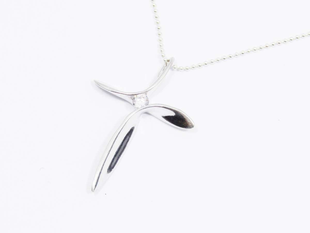 A Beautiful Abstract Design Cross with  a Tiny Zirconia on Chain in Sterling Silver