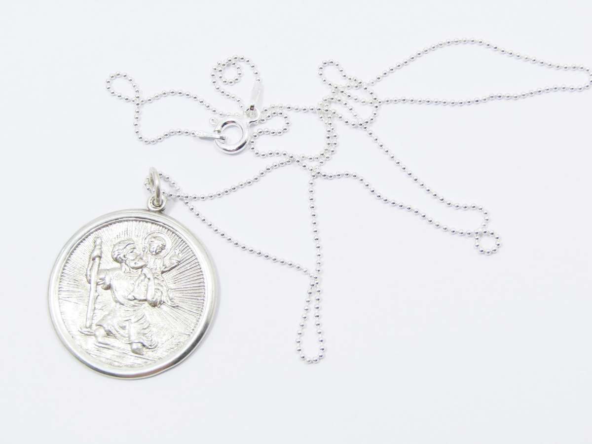 A Beautiful Detailed Round St Christopher Pendant on Chain in Sterling Silver.