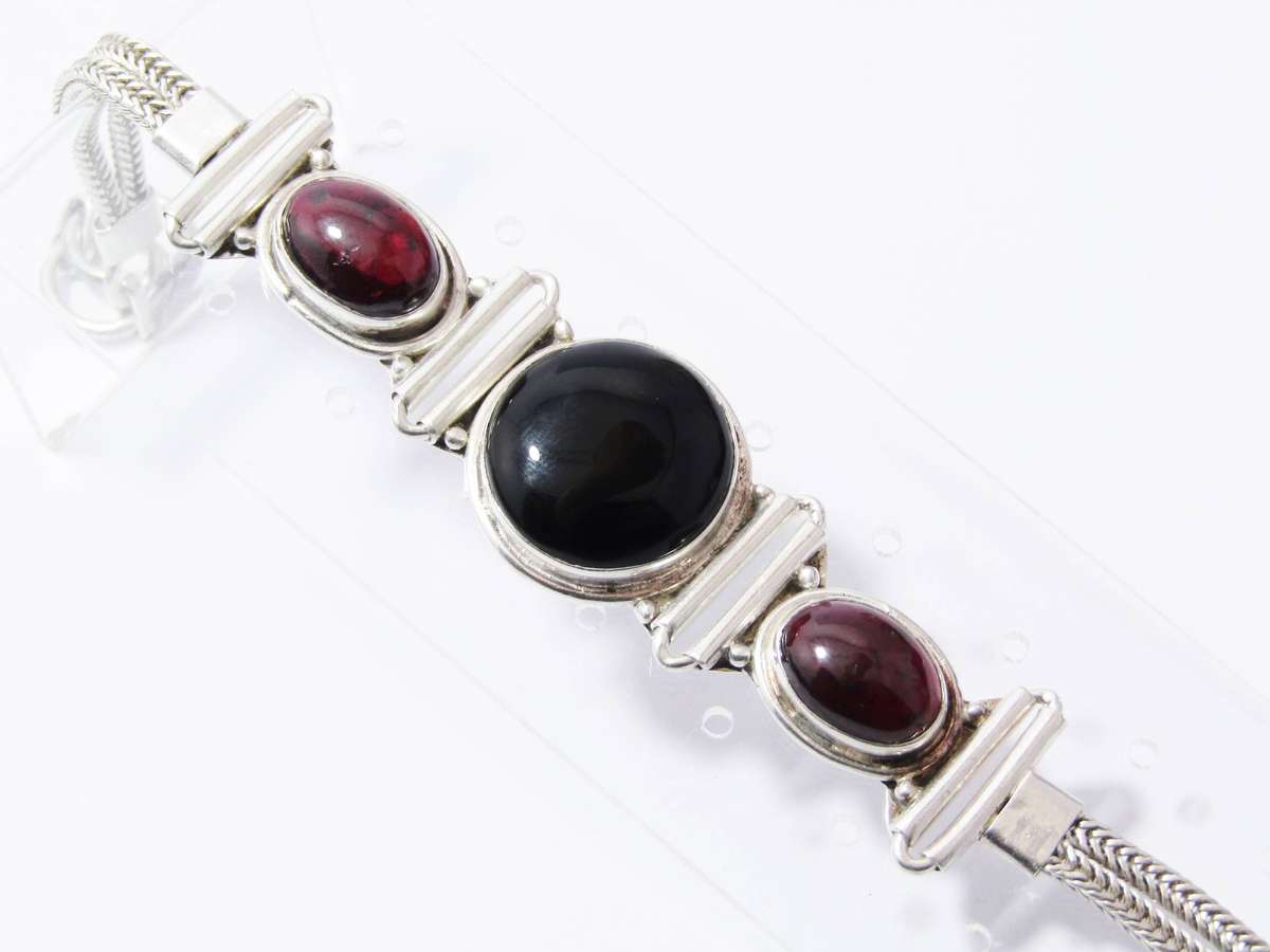 A Gorgeous Weighty Cabochon Garnet and Onyx Gemstone Bracelet in Sterling Silver.