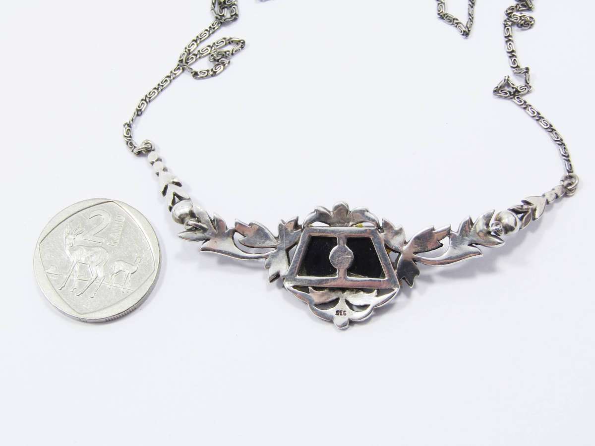 A Gorgeous Vintage Design Onyx Set with a Cultured Pearl Dotted with Marcasite's in 935 Silver