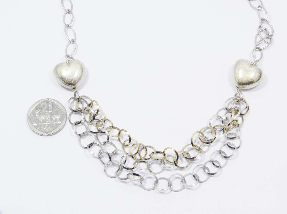 A Beautiful Puffy Heart Necklace Made up in Circles in Sterling Silver.