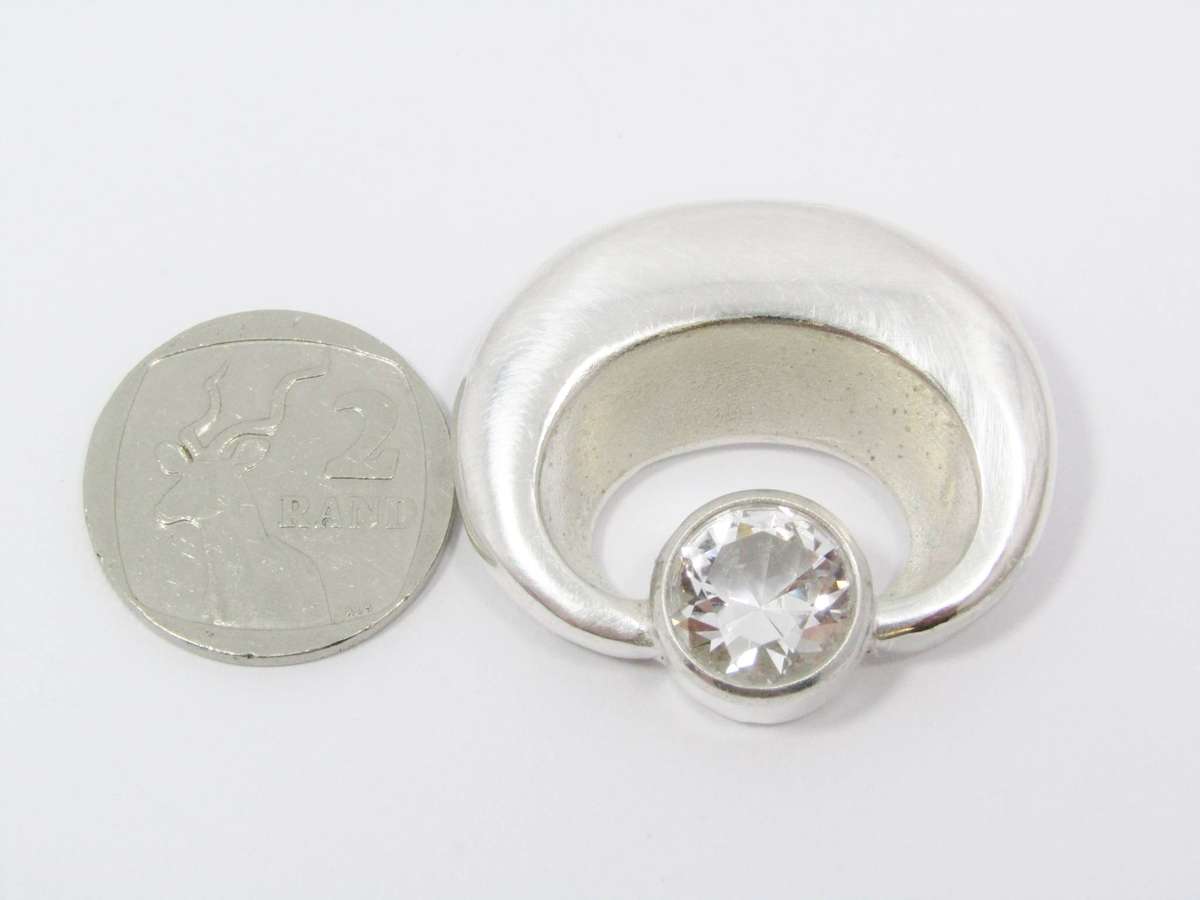 A Lovely Solid Modernist Style Brooch With a Rock Crystal in Silver.