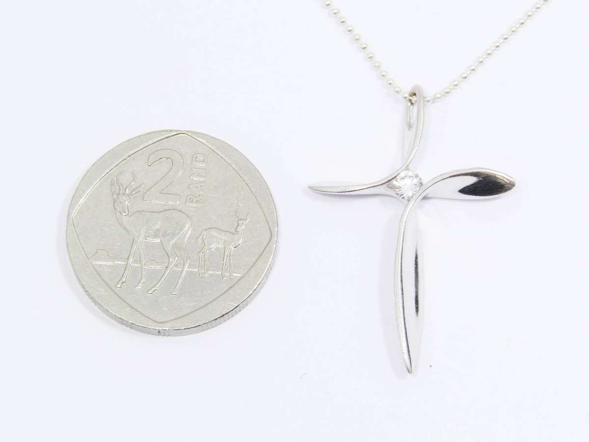 A Beautiful Abstract Design Cross with  a Tiny Zirconia on Chain in Sterling Silver