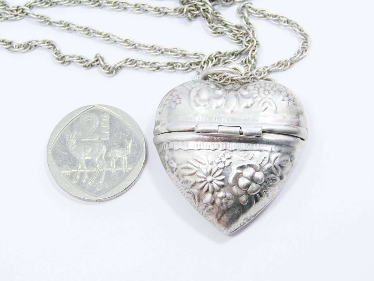 A Gorgeous Repoussé Large Keepsake Locket on Chain in Sterling Silver.