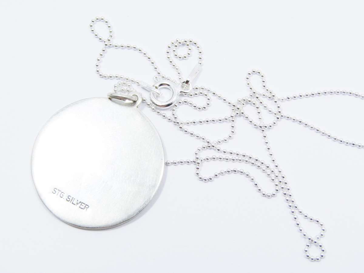 A Beautiful Detailed Round St Christopher Pendant on Chain in Sterling Silver.