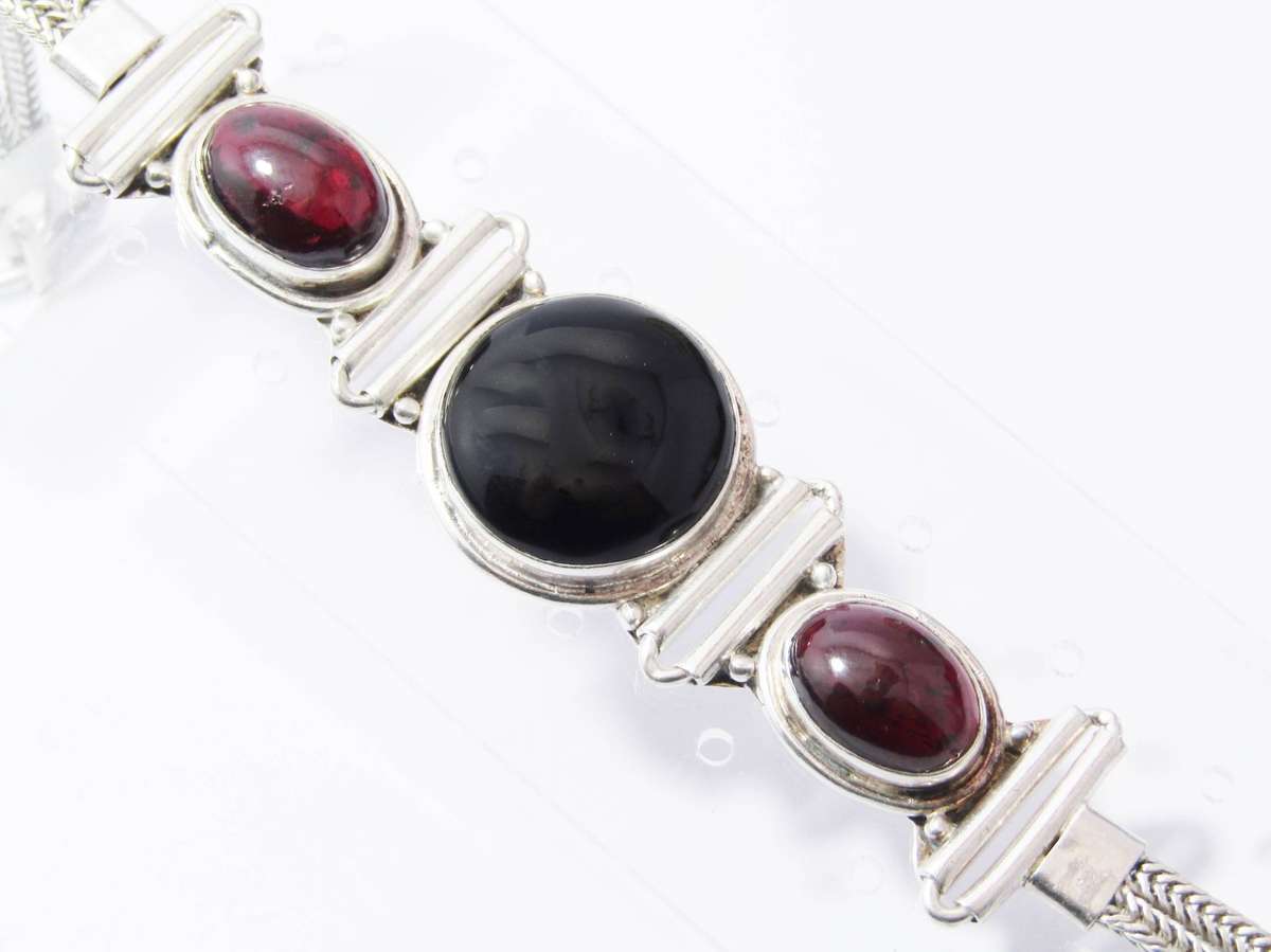 A Gorgeous Weighty Cabochon Garnet and Onyx Gemstone Bracelet in Sterling Silver.