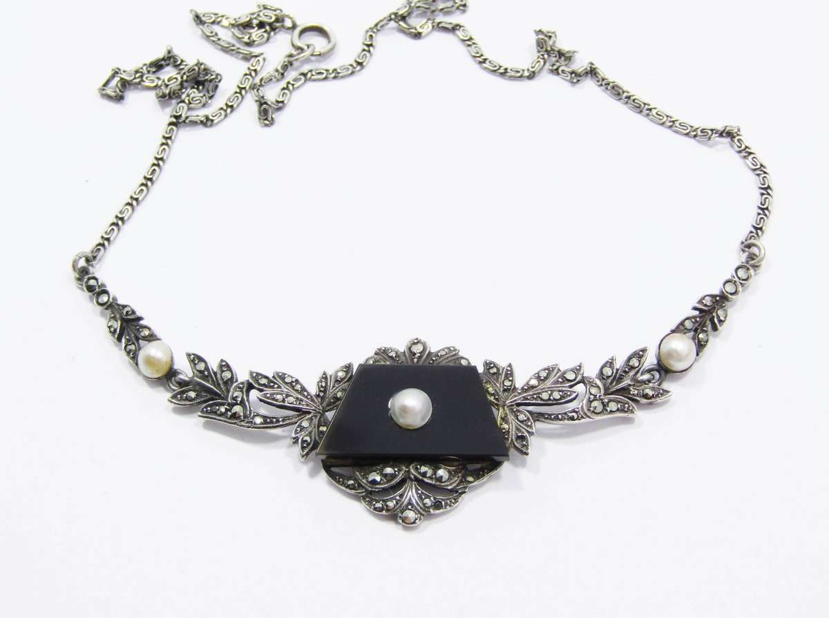 A Gorgeous Vintage Design Onyx Set with a Cultured Pearl Dotted with Marcasite's in 935 Silver