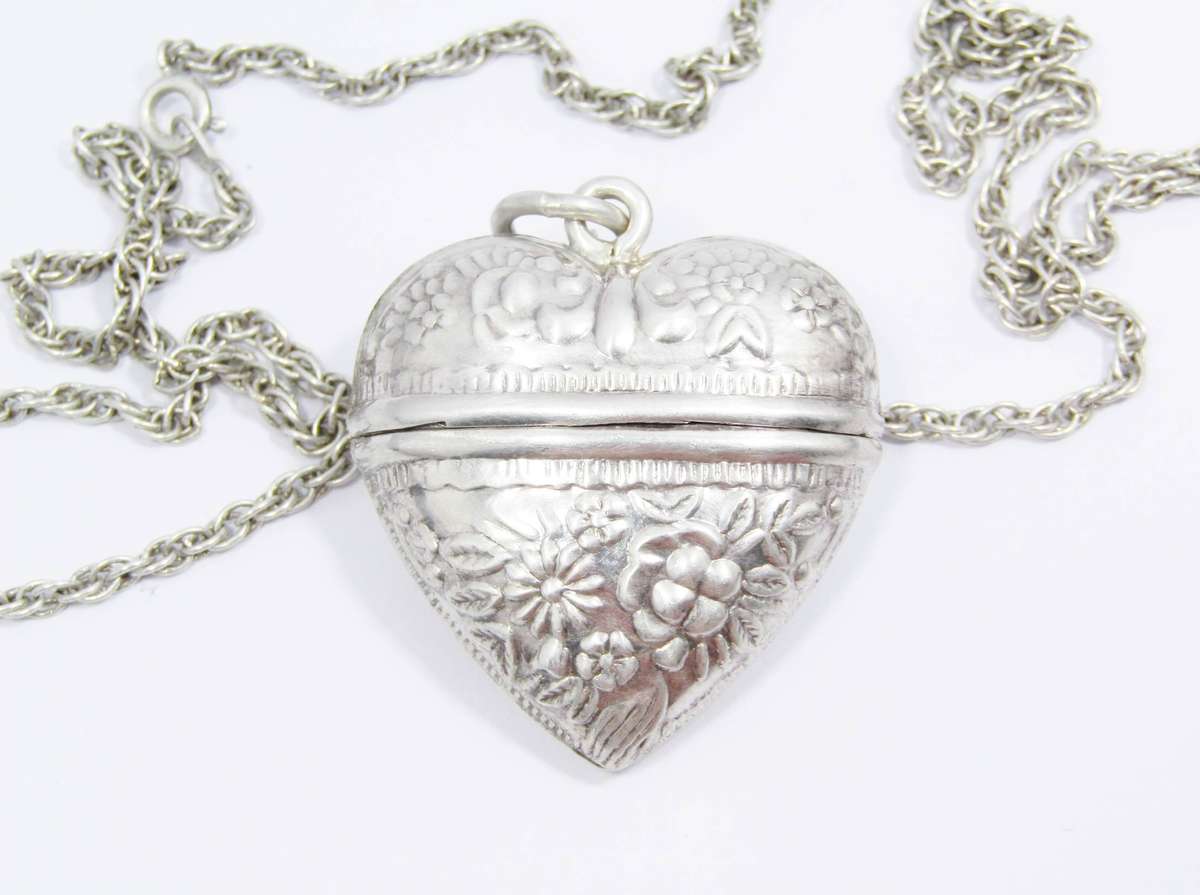 A Gorgeous Repoussé Large Keepsake Locket on Chain in Sterling Silver.