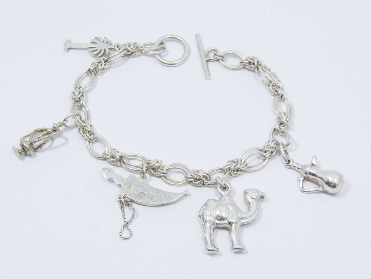 A Lovely Weighty Bracelet With Charms in Sterling Silver.
