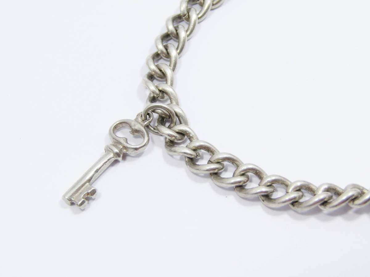 A Lovely Vintage Charm Bracelet in Sterling Silver.