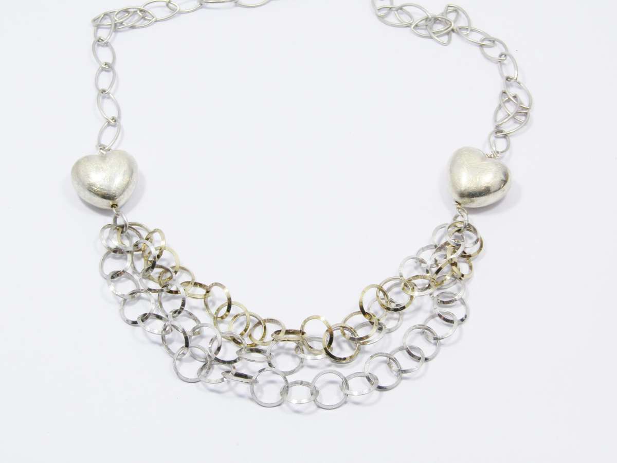 A Beautiful Puffy Heart Necklace Made up in Circles in Sterling Silver.