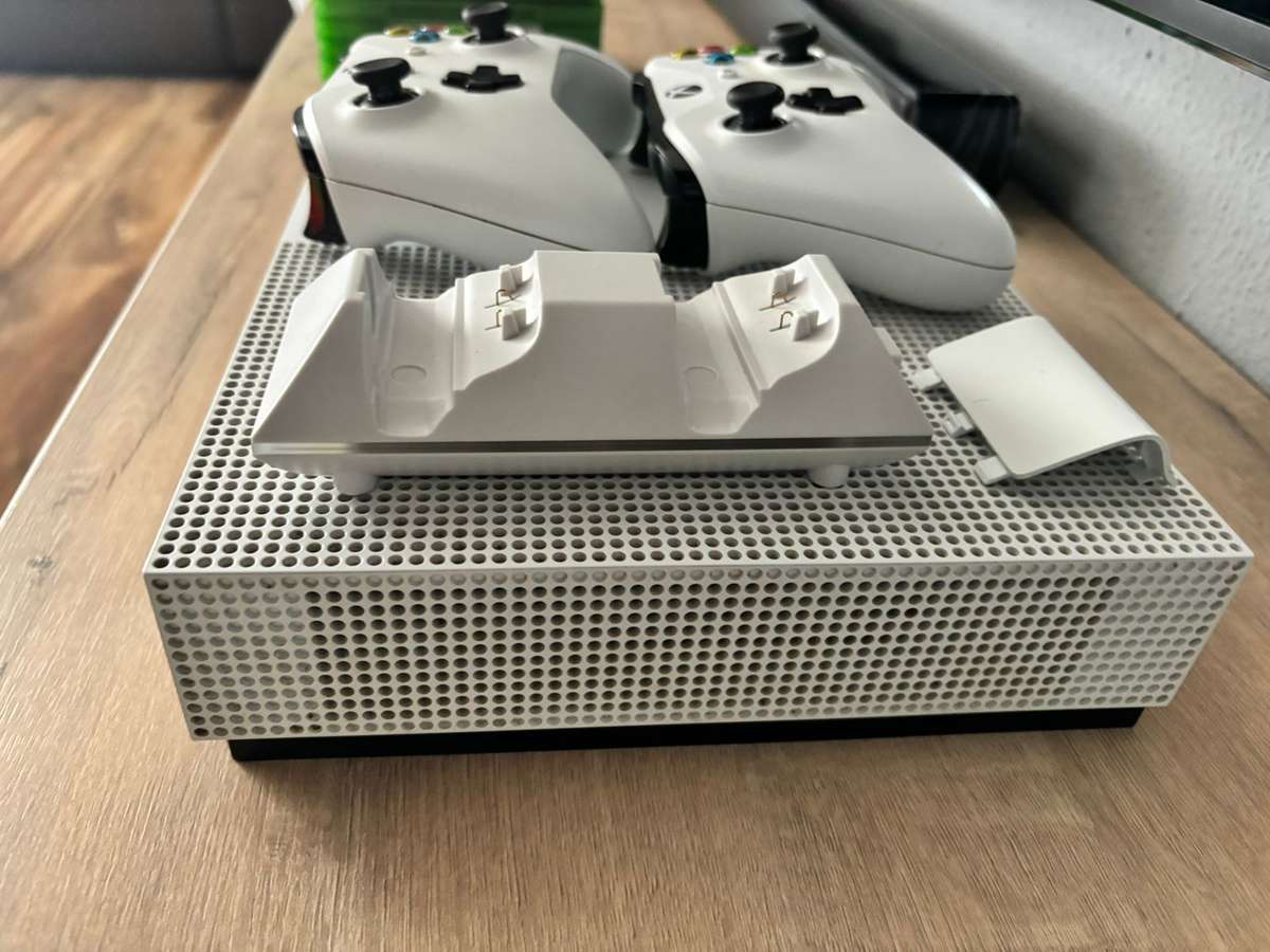 Xbox one consol with 2 remotes and wireless charger