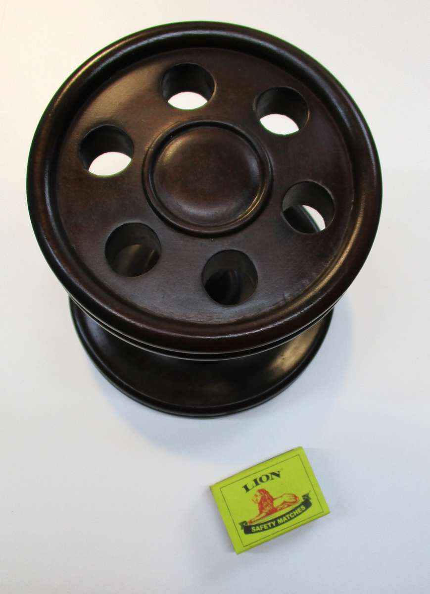 Old solid wood pipe stand for six pipes