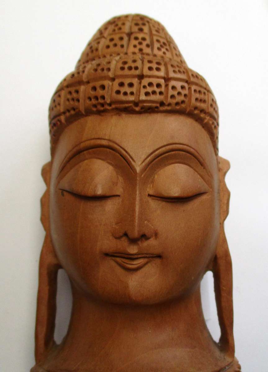 Hand carved wooden Buddha Head