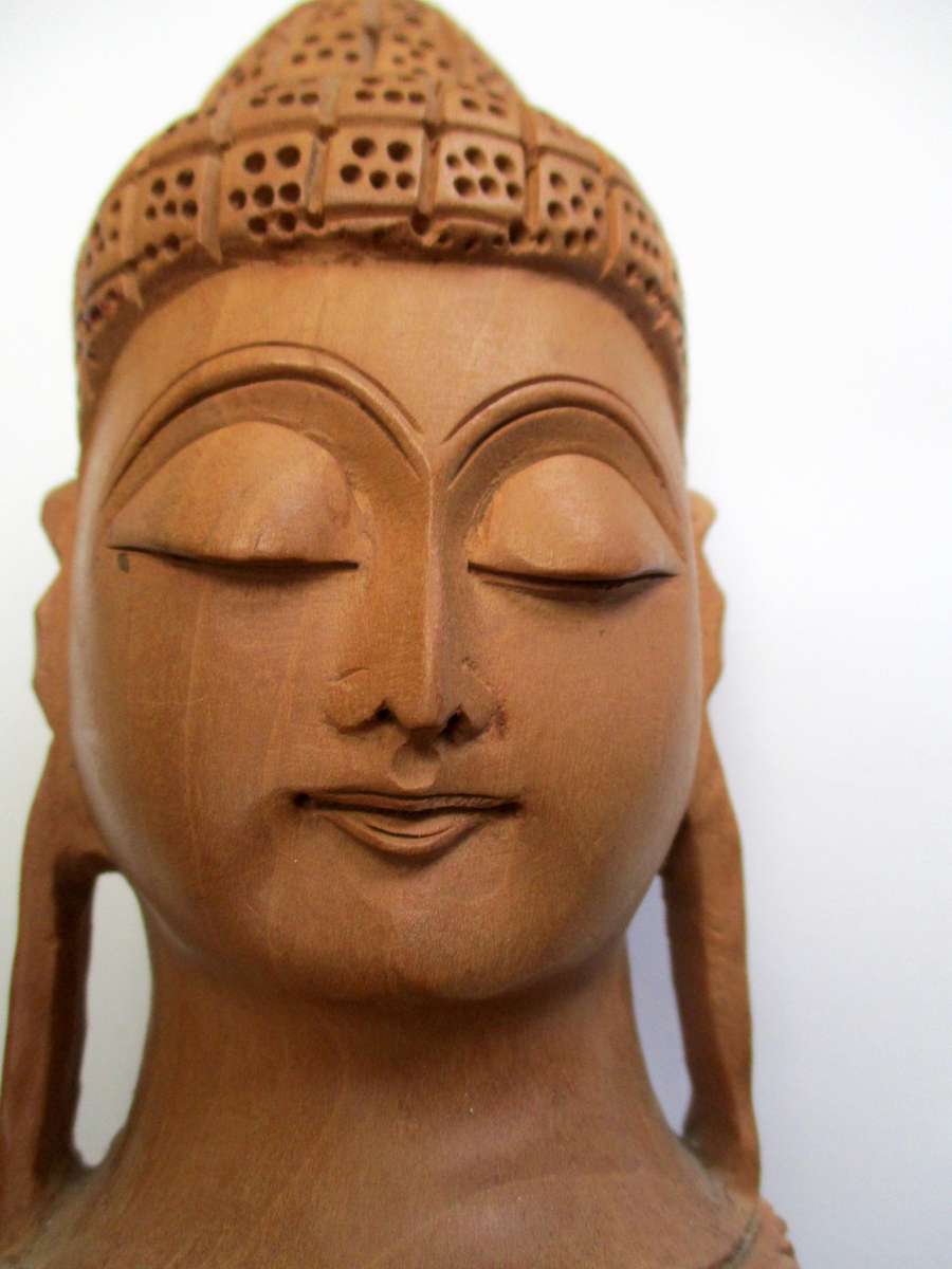 Hand carved wooden Buddha Head
