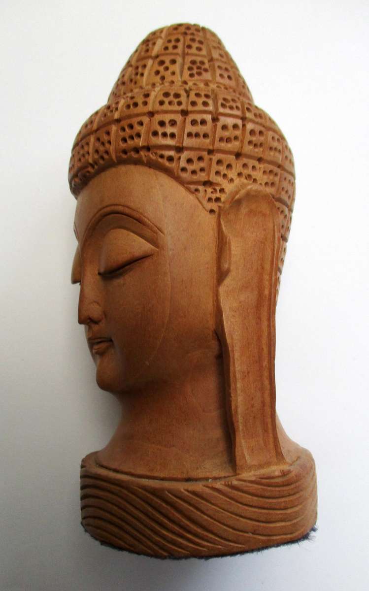 Hand carved wooden Buddha Head