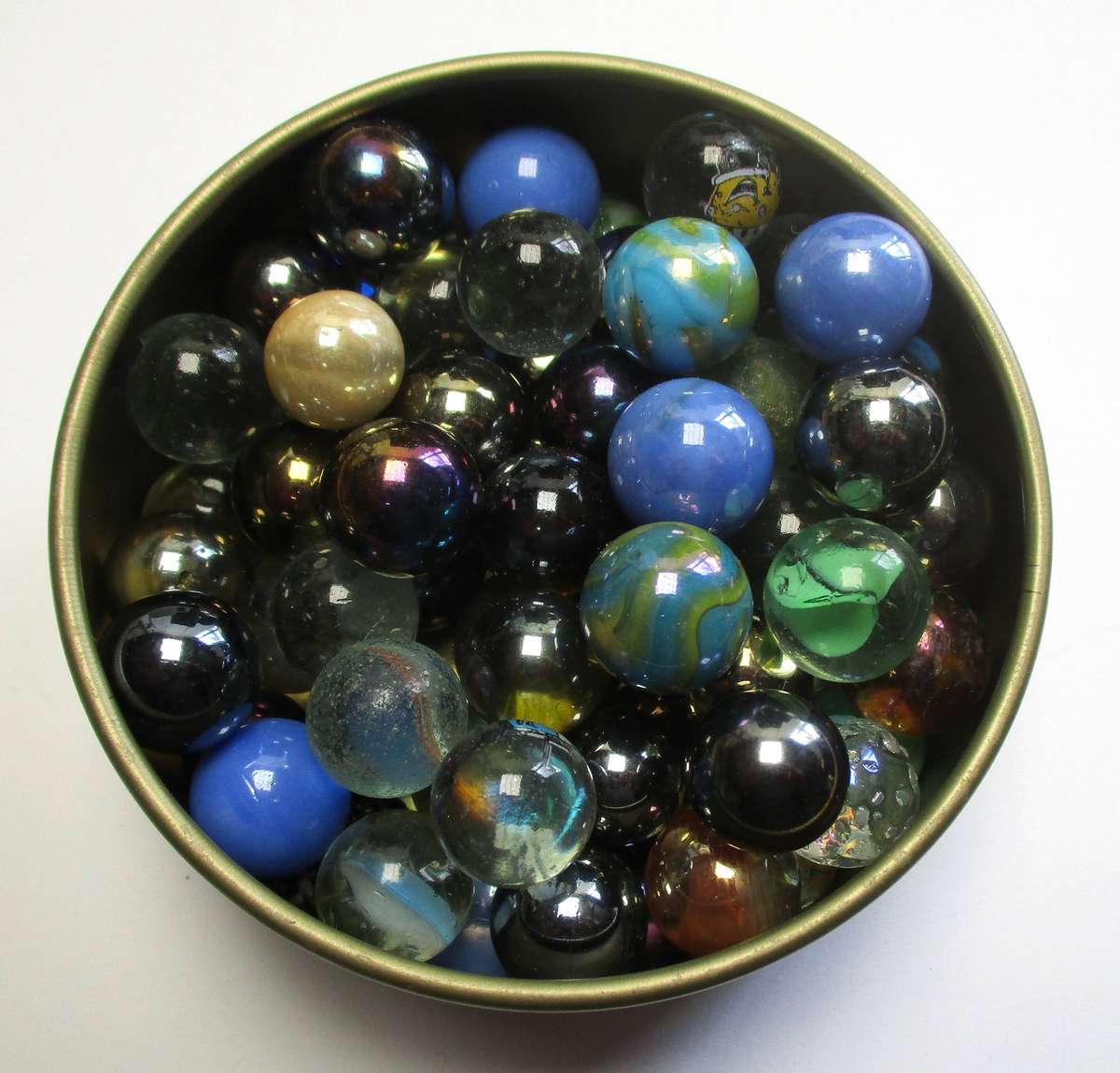 Glass Marbles in small tin.
