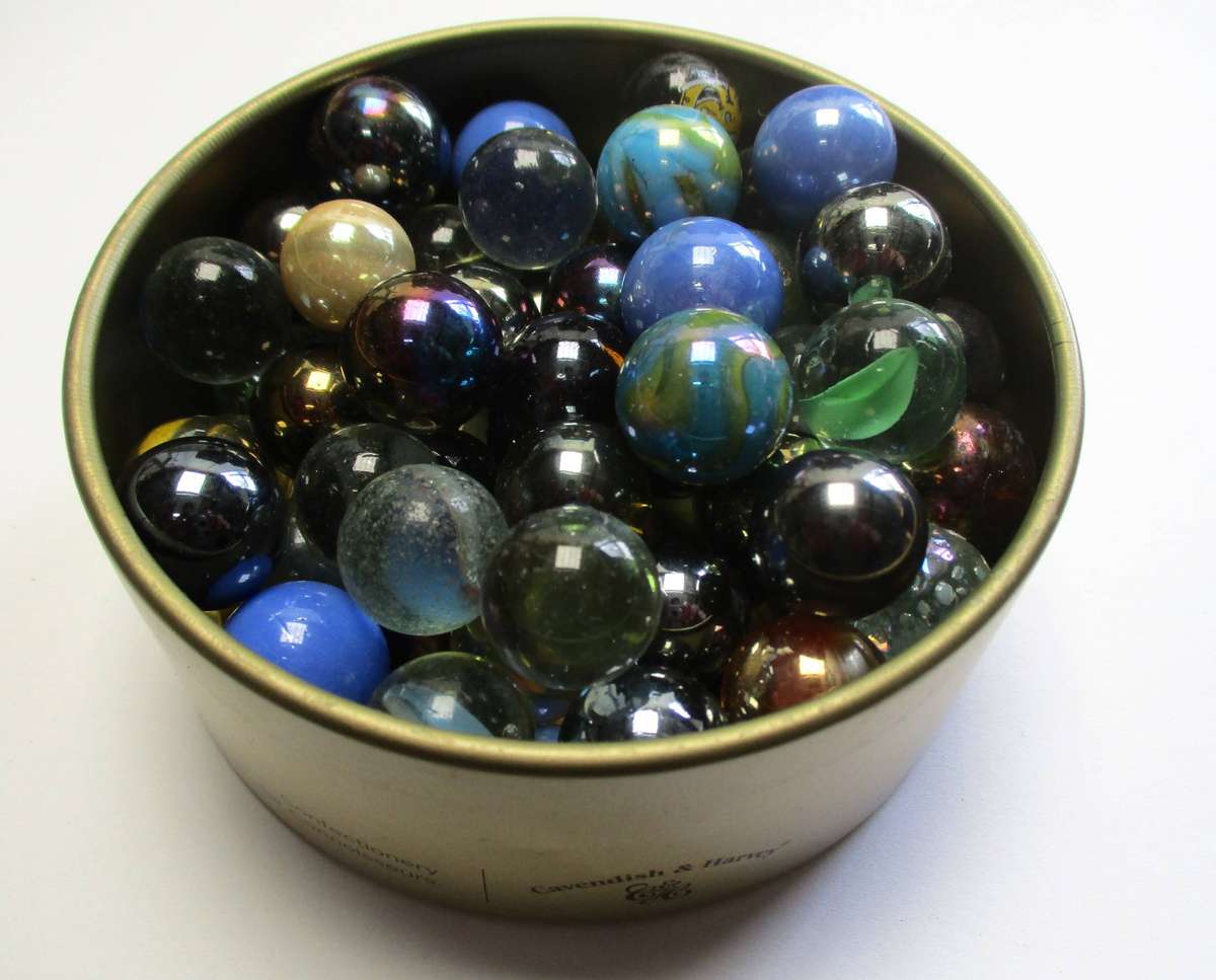 Glass Marbles in small tin.