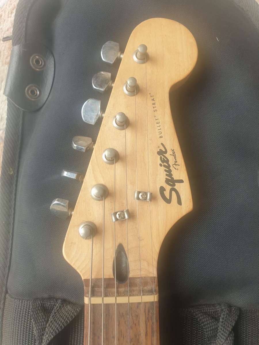 Fender Squire Bullet electric guitar with bag made in Indonesia, Red and white