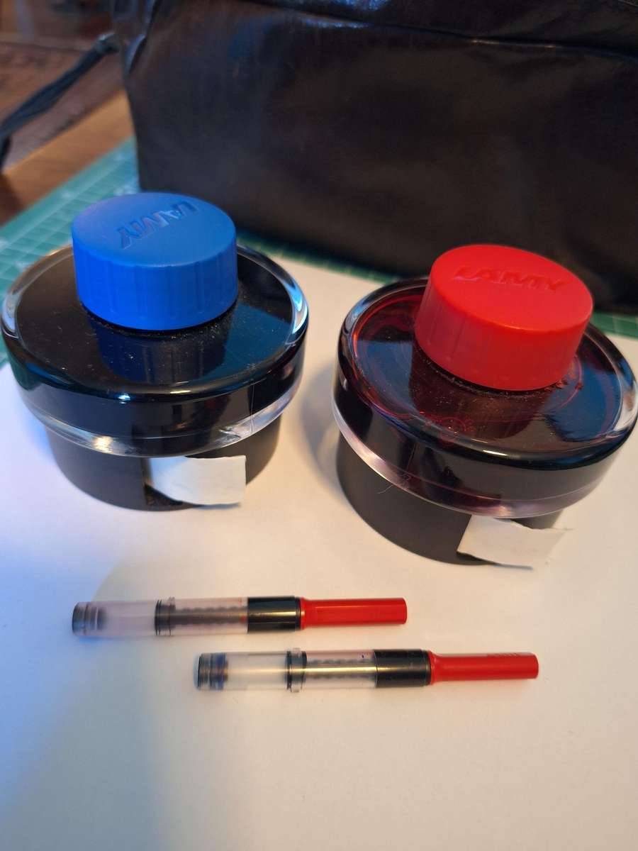 Lamy Blue and Red ink bottles, also two Lamy ink converters