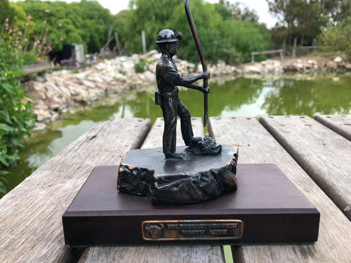 Awesome Bronzed metal miners statue mounted to mahogany base from Wildebeestfontein mine