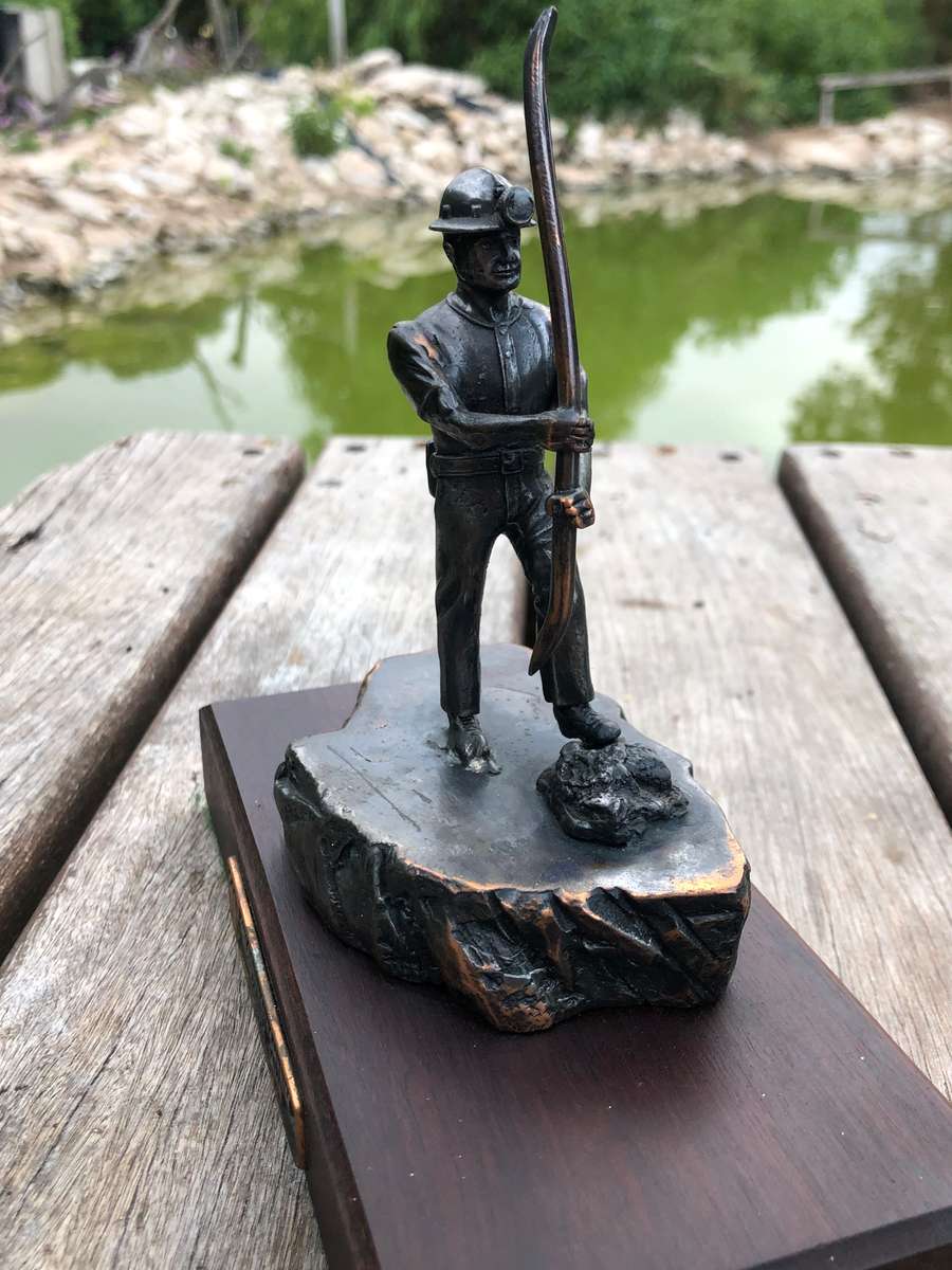 Awesome Bronzed metal miners statue mounted to mahogany base from Wildebeestfontein mine