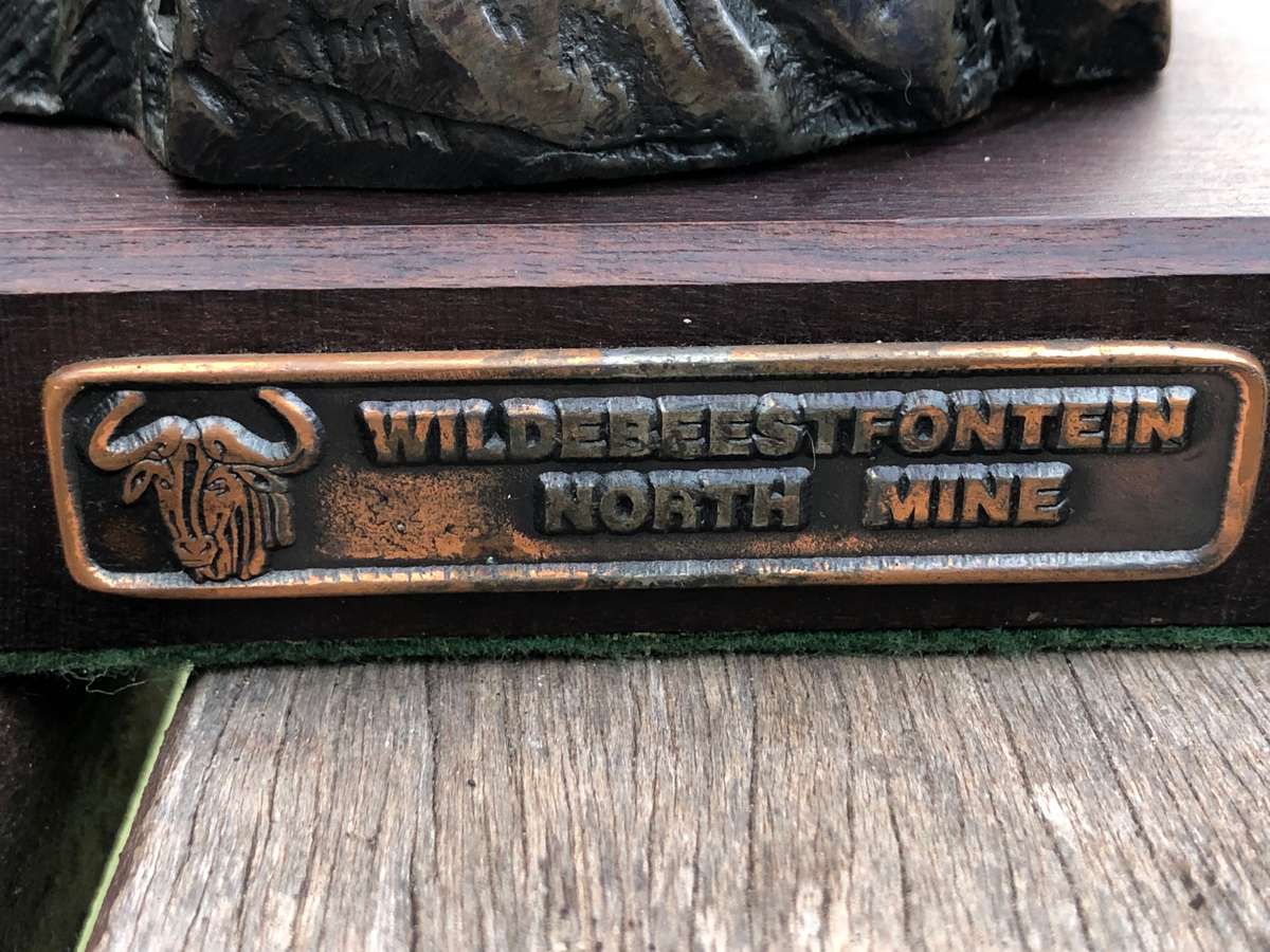 Awesome Bronzed metal miners statue mounted to mahogany base from Wildebeestfontein mine