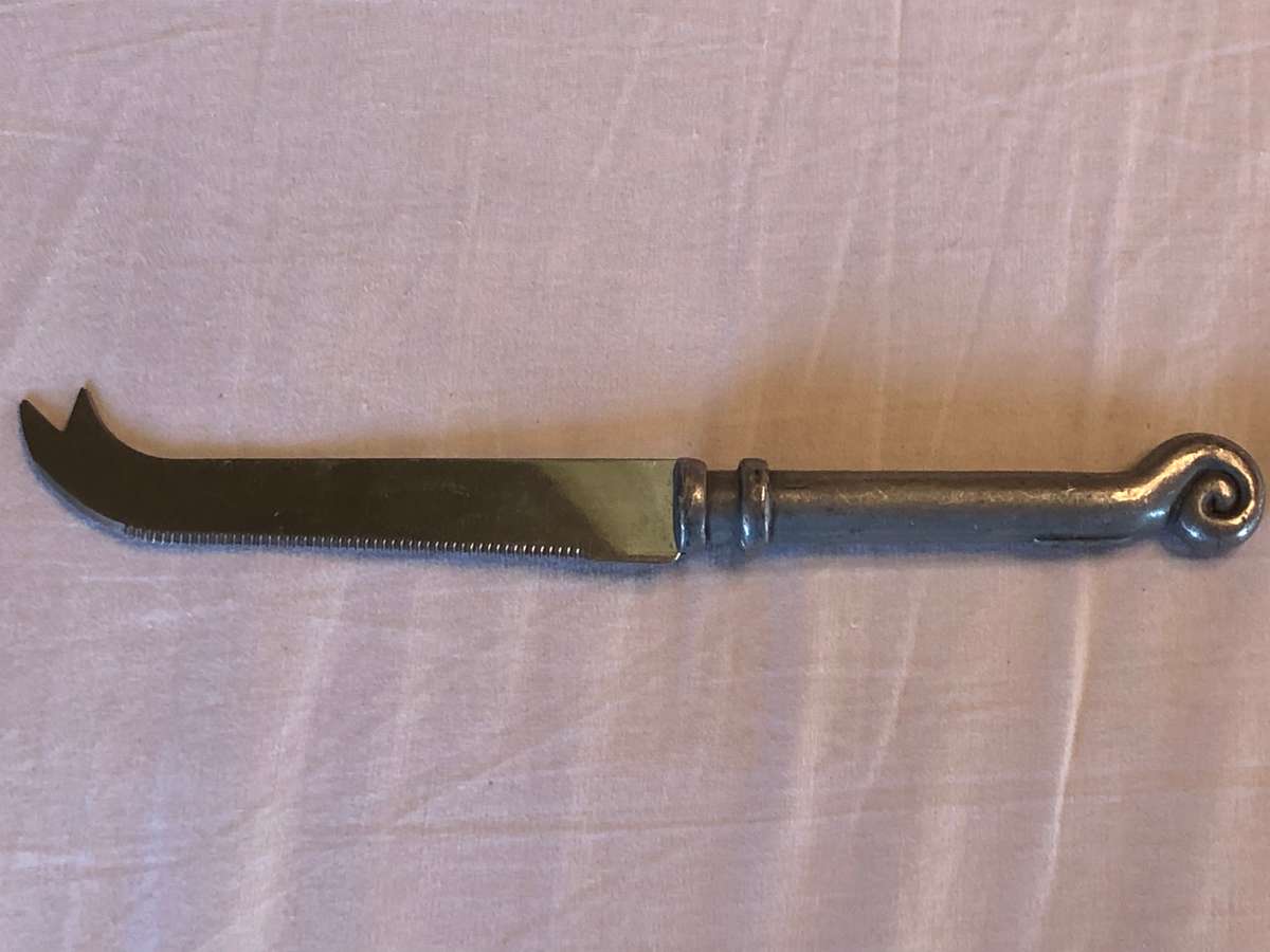 Carrol Boyes coil pattern cheese knife -  serrated blade