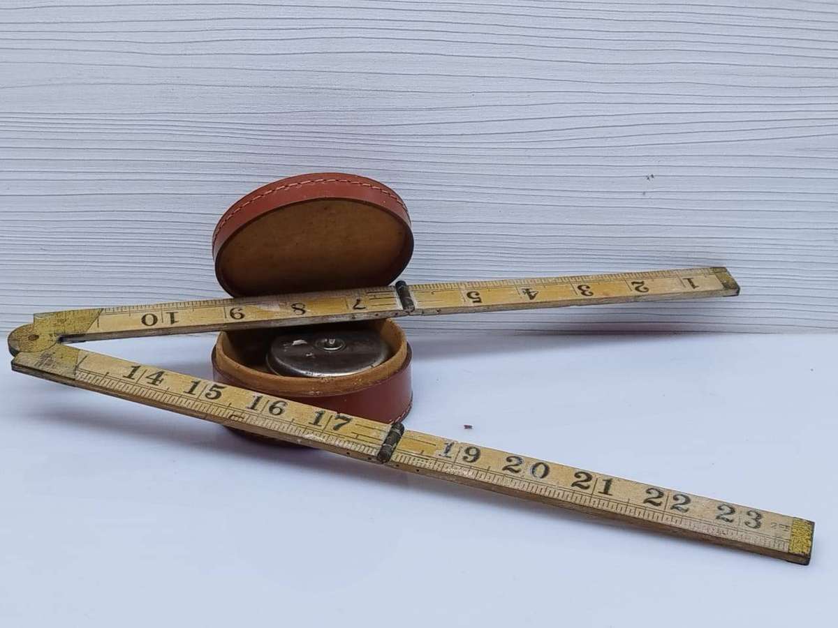 Rabone boxwood and brass folding carpentry ruler No 1167 and a vintage Eidesco measuring tape