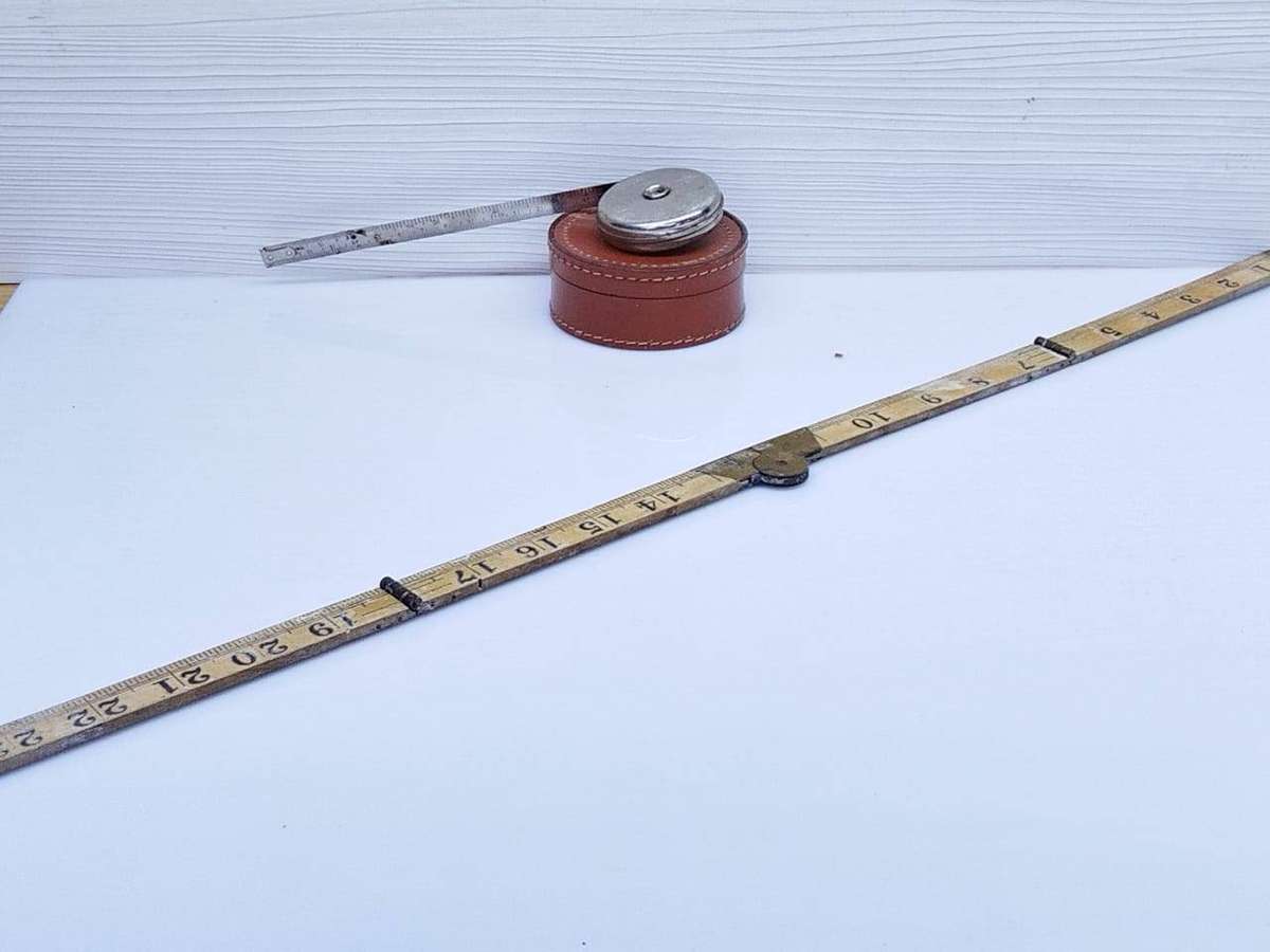 Rabone boxwood and brass folding carpentry ruler No 1167 and a vintage Eidesco measuring tape