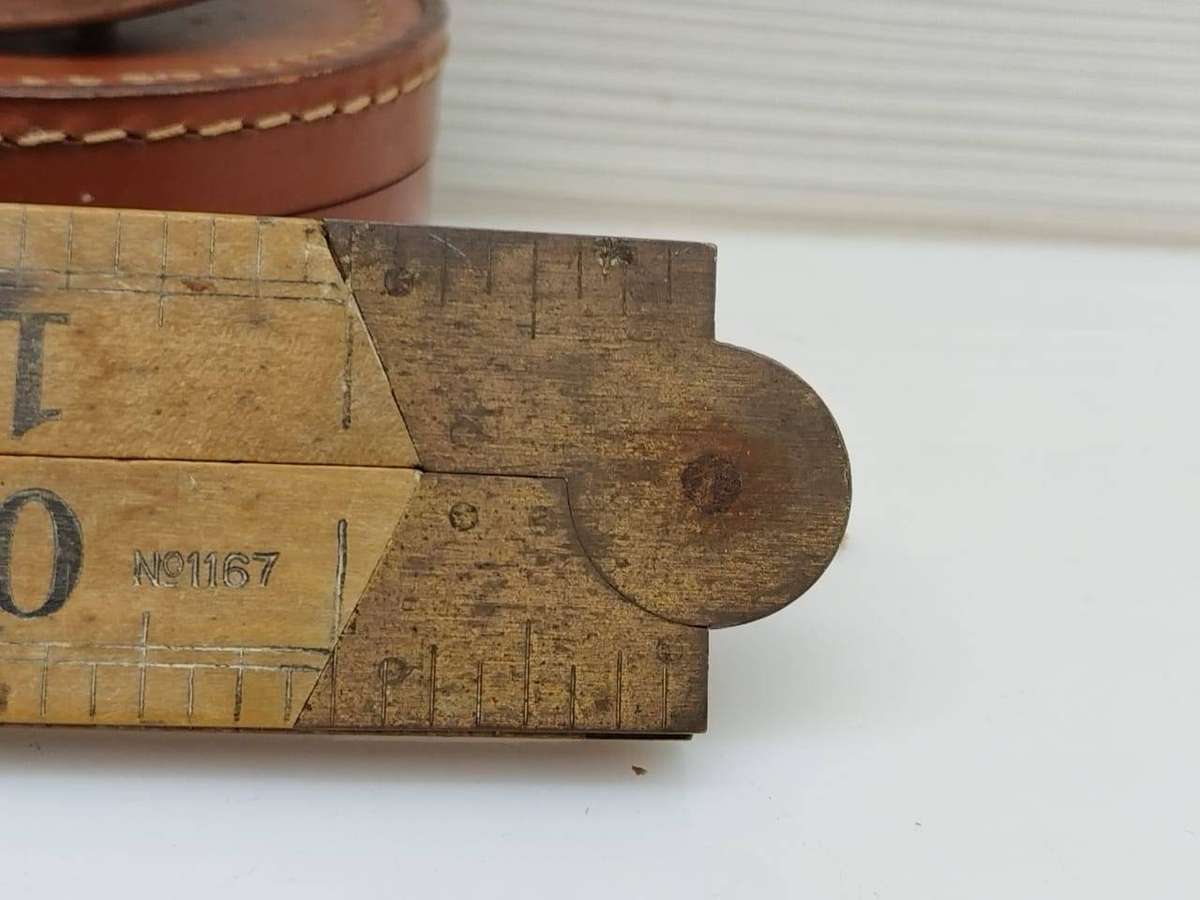 Rabone boxwood and brass folding carpentry ruler No 1167 and a vintage Eidesco measuring tape