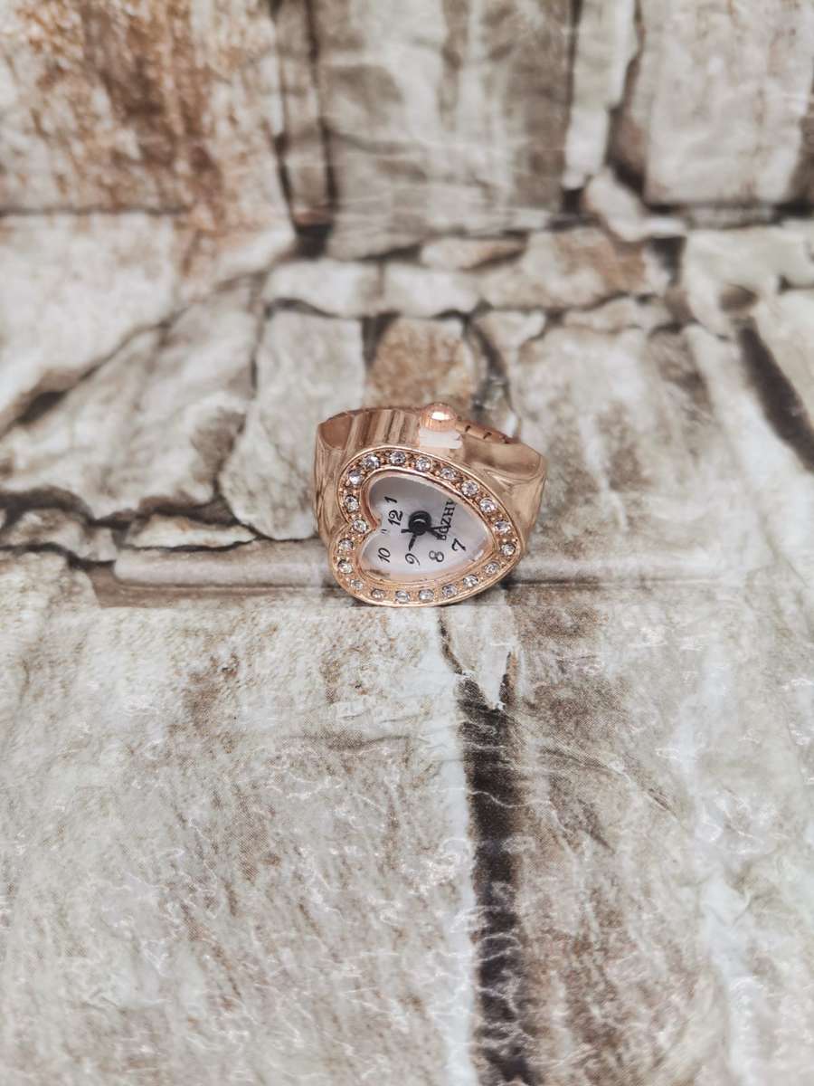 NEW TREND ---FINGER WATCH WITH STRECH BAND--ONE SIZE FITS ALL  GOLD TONE-BLACK FACE